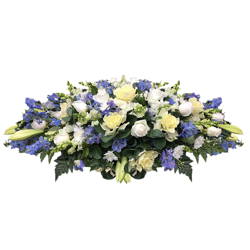 There's no name more fitting for this beautiful blue & white table arrangement. Baby blue forget me not flowers nestle beneath white roses, carnations & lilies.