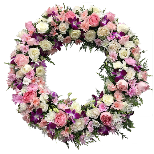 Like butterflies, purple dendrobium orchids flutter amongst a peachy garden of roses, chrysanthemums and buttercup flowers arranged in a ring wreath.