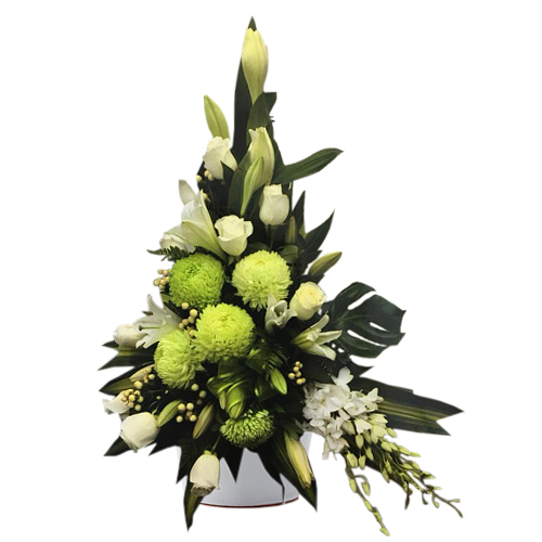 Share the grieving family or friends your support during with this elegant blooms of white roses, lilies & orchids as well as yellow-green chrysanthemums.