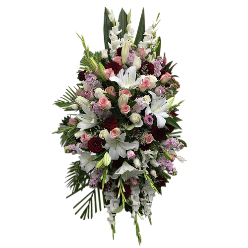 White stargazer lilies pierce through gushing roses and stock flowers. Your care and support with this beautiful floral arrangement will always be remembered.