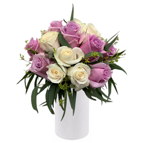 Classic and simple. Creamy white roses put together with lavender purple roses, nestled between and complimented by Australian native eucalyptus dull grey green leaves. Send this to someone special today.