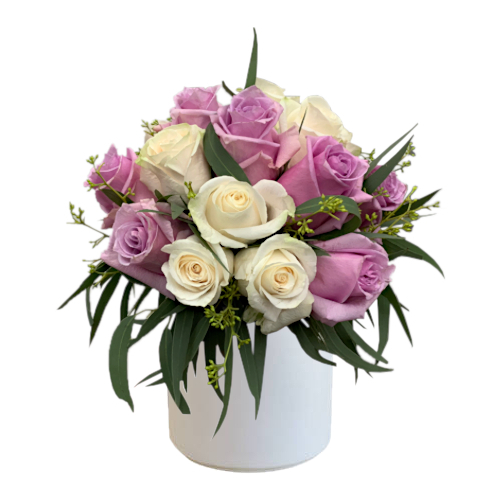 The pastel colour palette basket filled with gorgeous roses and stock flowers in muted pink and purple tones will make the recipient's day sweeter.