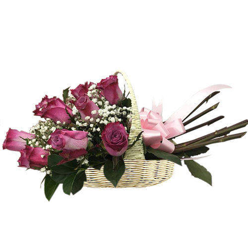 Featuring bold & beautiful magenta roses highlighted against delicate baby's breath. Tied together with a matching bow & presented in a basked. Celebrate a birthday, anniversary, mother's day or the arrival of a newborn. 
