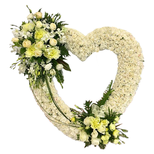 Contemporary twist on traditional white wreath. Pay tribute at the final farewell of a loved one with blooming white & cream flowers arranged in a heart shape.