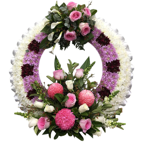Send your message of love, hope & comfort to your beloved recipient with this beautiful pink & purple wreath of rose, lily & chrysanthemum varieties.