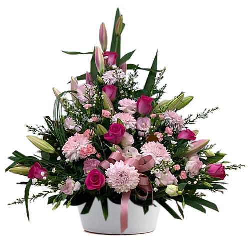 Surprise someone special with this beautiful blushing pink arrangement featuring chrysanthemums, roses, carnations, lilies and stock flowers.