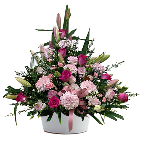 Surprise someone special with this beautiful blushing pink arrangement featuring chrysanthemums, roses, carnations, lilies and stock flowers.